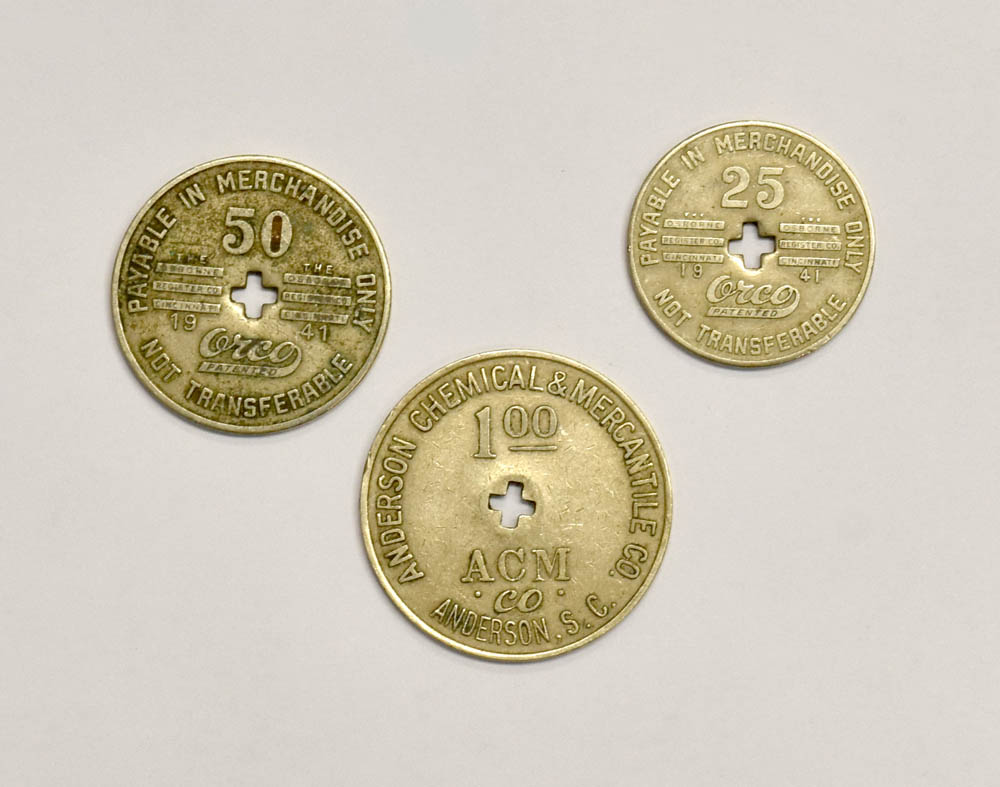 three gold colored coins 